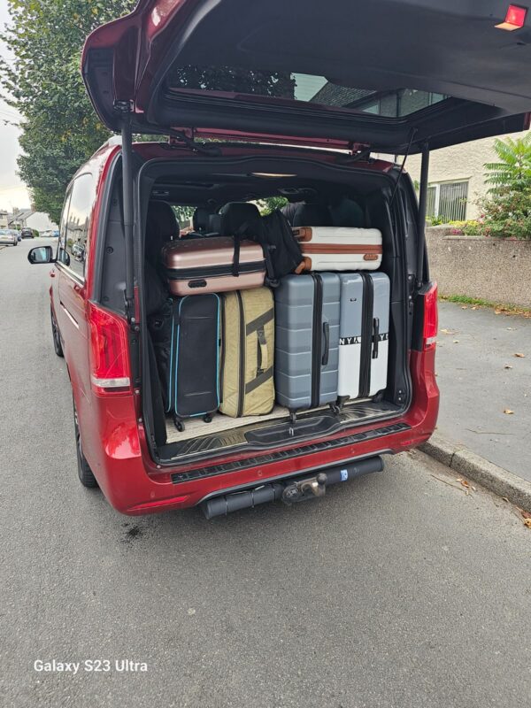 Red Mercedes Benz V-Class Boot Open Filled With Passengers Travelling Luggages UK - Safe Travels VIP Chauffeur Services