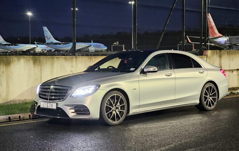 Silver Mercedes UK Parked Outside Airport - Safe Travels VIP Chauffeur Services