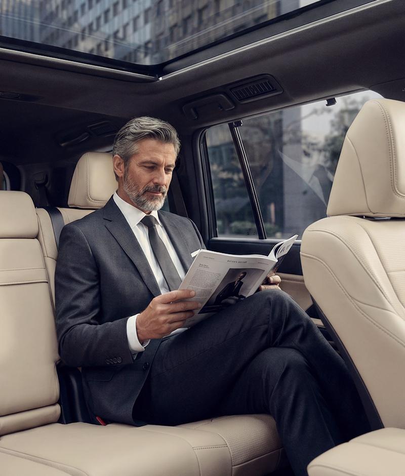 Passenger Reading Magazine, Chauffeur Services UK - Safe Travels VIP Chauffeur Services